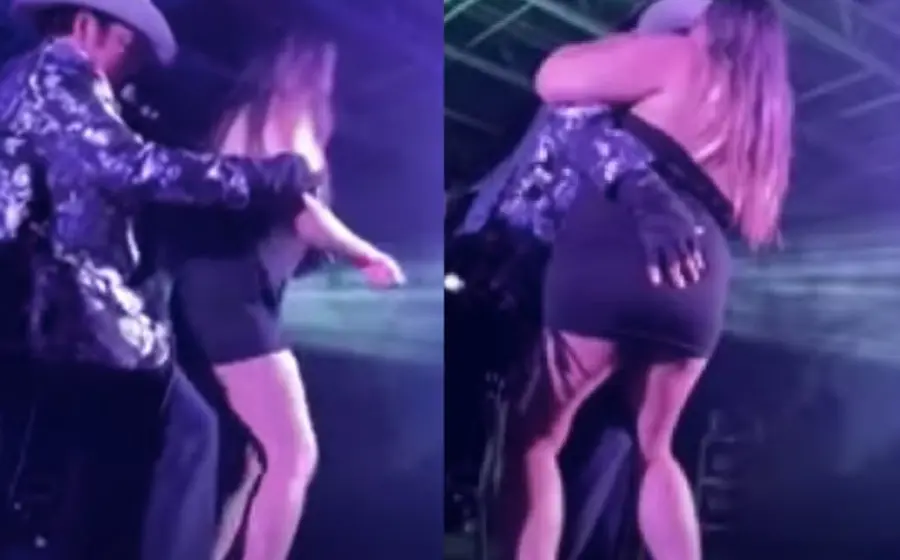 Imágenes muestran cómo aparentemente se aprovecha de una fan que se subió al escenario para presuntamente realizar tocamientos inapropiados.