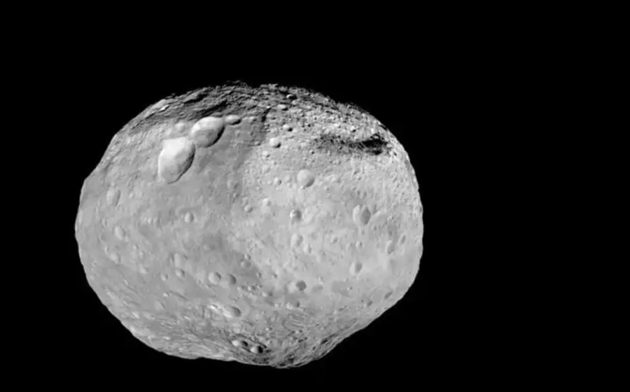 Una ilustración del asteroide Vesta, el más grande del cinturón principal, que alberga una imponente montaña central más alta que el Everest.