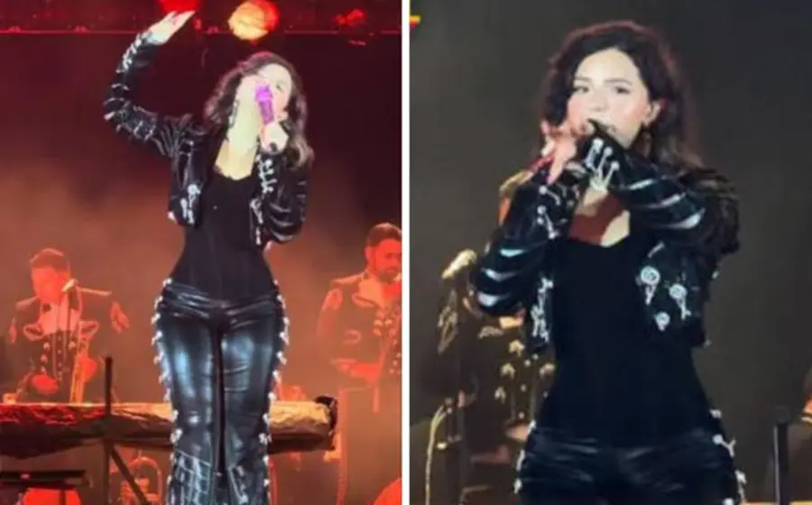 La cantante Ángela Aguilar sobre el escenario durante su presentación en Colombia, donde fue ovacionada por el público por su talento y figura estilizada.