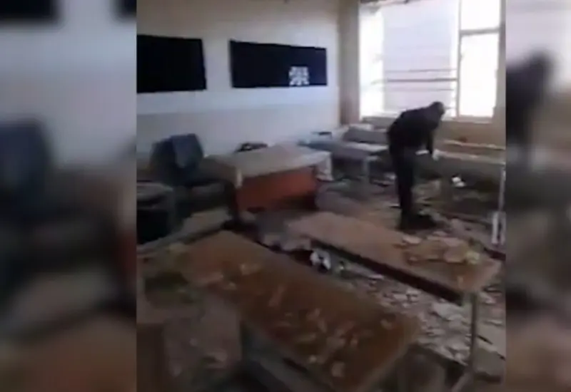 Varias autoridades analizan el alcance de los daños estructurales en una escuela impactada por el conflicto en el Medio Oriente.